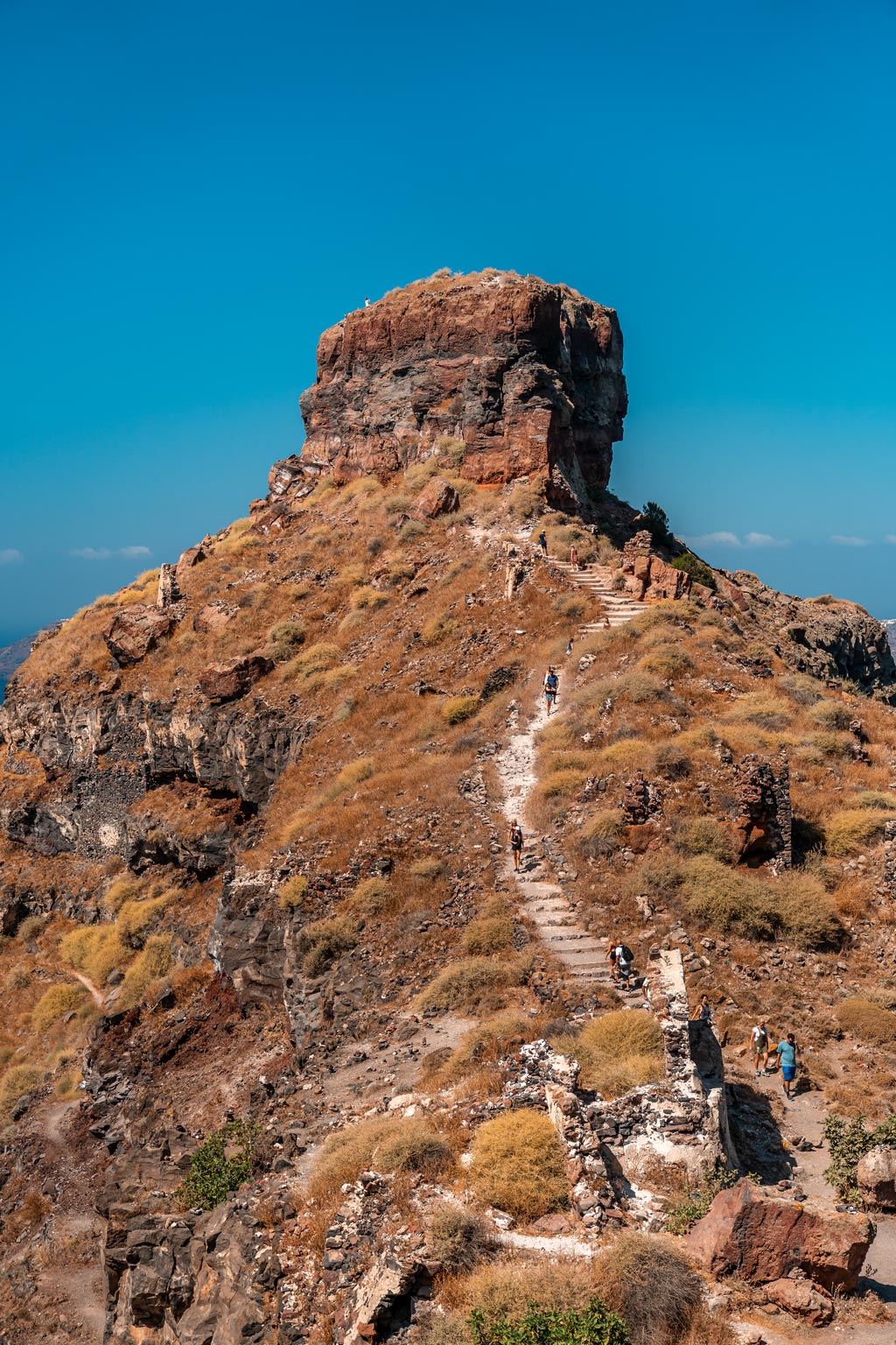 People Climbing to Skaros Rock in Santorini