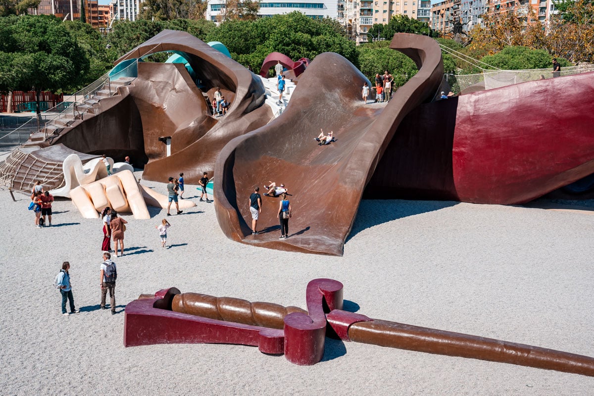 Gulliver Park playground in Turia Gardens, Valencia, featuring giant slides and climbing areas.