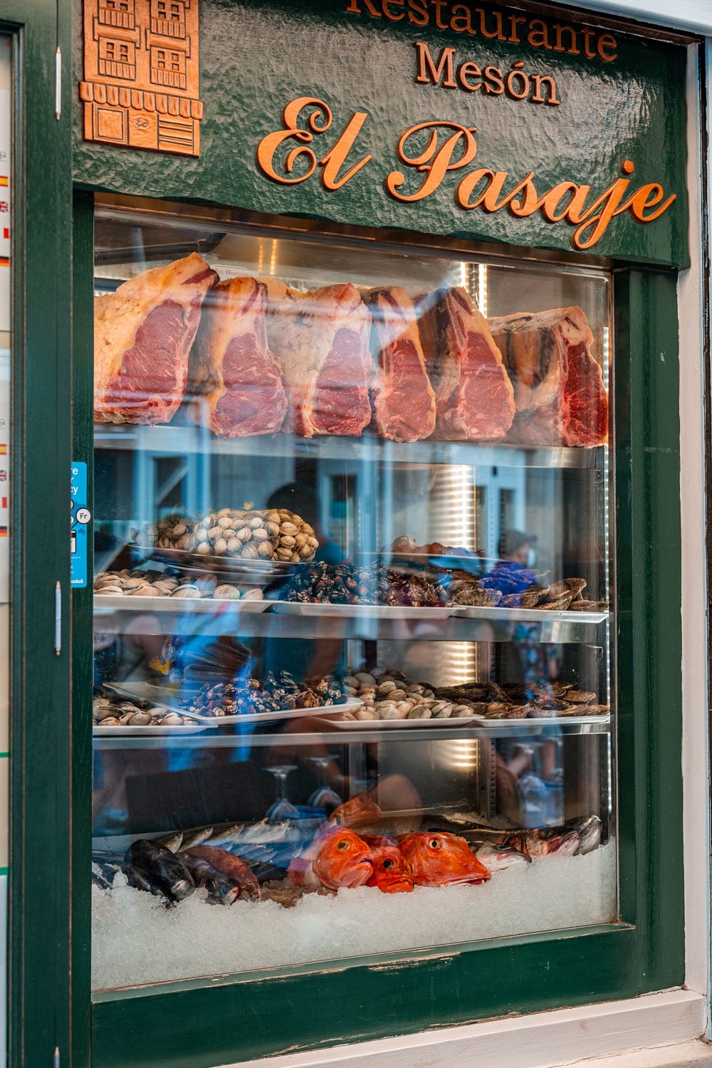 Restaurant window dispay with fresh seafood and meat