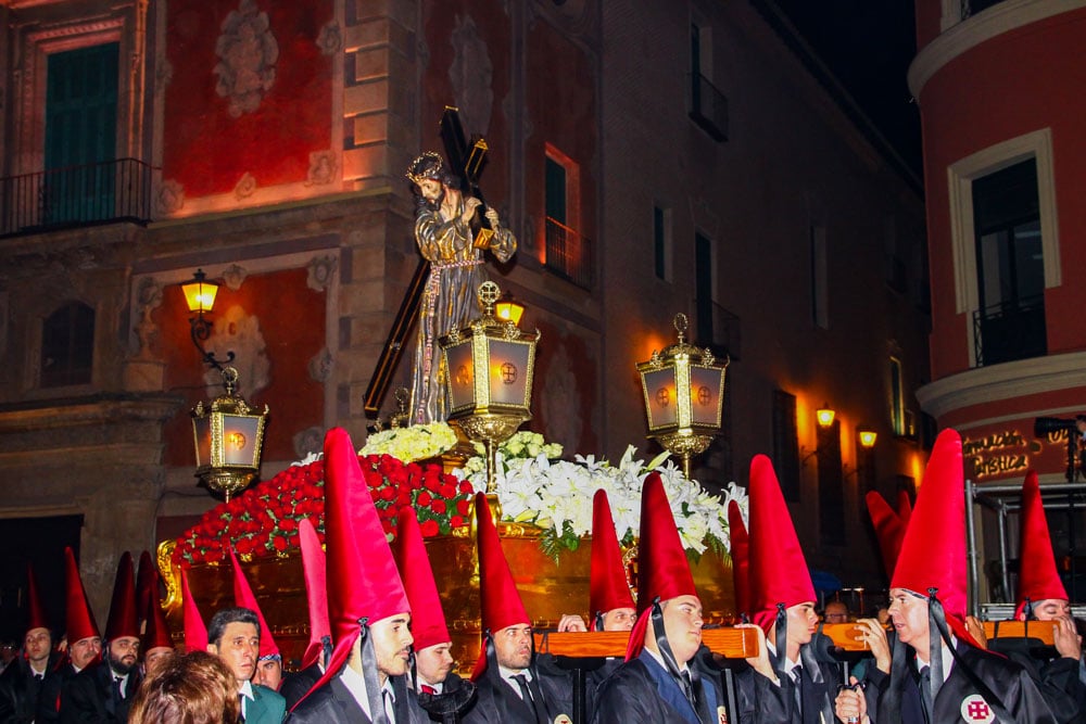Holy Week processions men carrying Jesus Christ statue