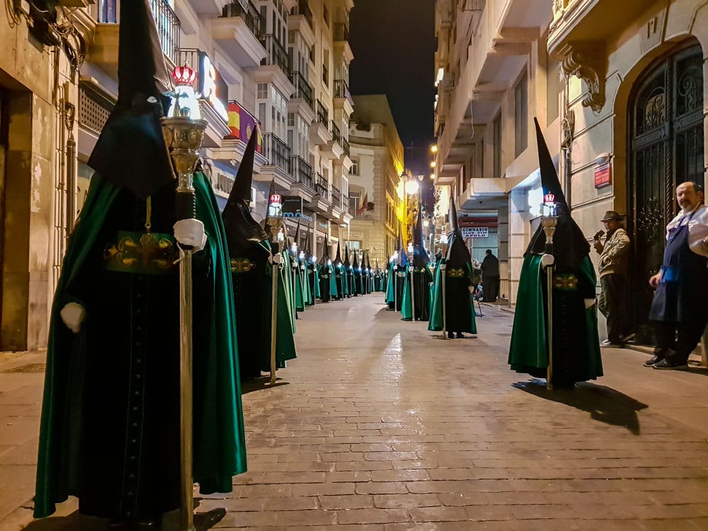 Hooded penitents parade during the Holy Week procession