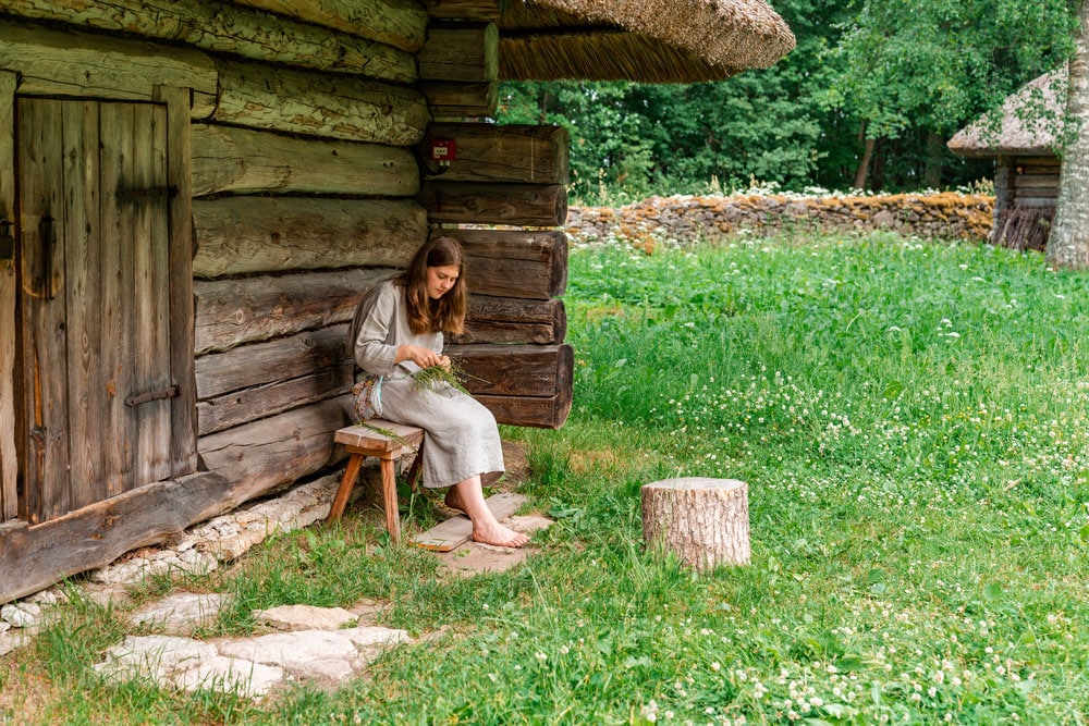 A Girl Braids a Wreath