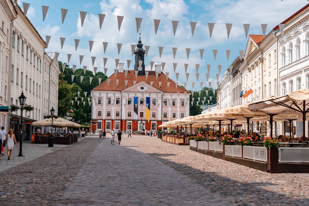 Cafes and the Kissing Students Sculpture with Fountain at Town Hall Square in Tartu