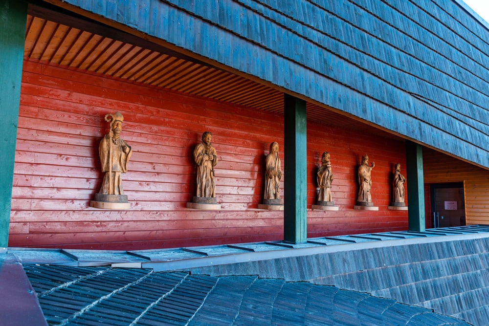 Wooden statues on the balcony of astronomical clock building.