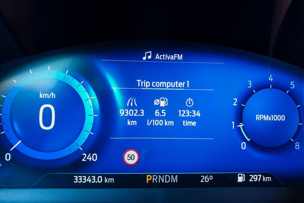 Car dashboard showing 9000 km while pregnant.