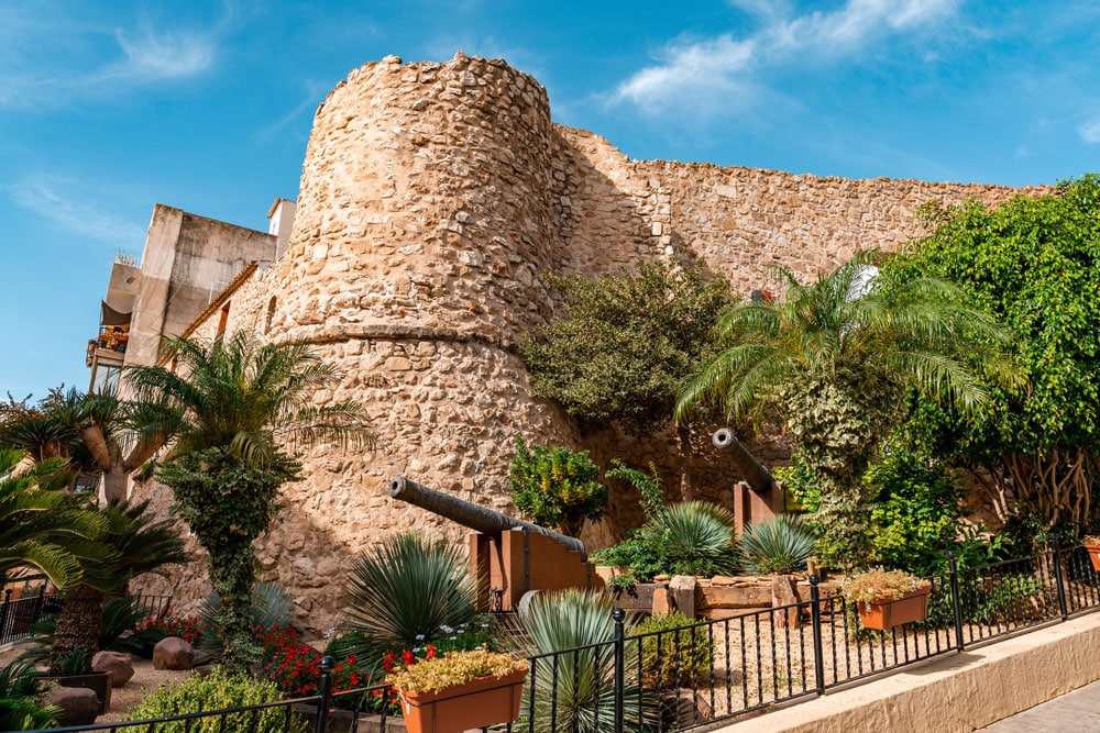 Torre de la Peca remains of the defensive walls with two cannons.