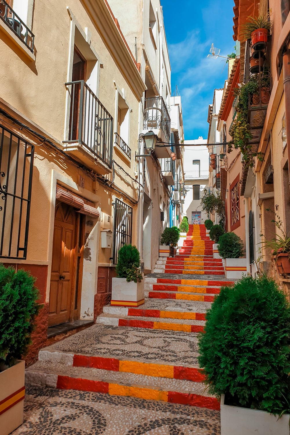 The steps in Calpe are painted in red and yellow, resembling the colors of the Spanish flag.