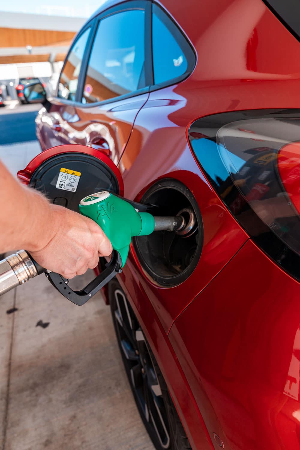 Refilling car in petrol station.