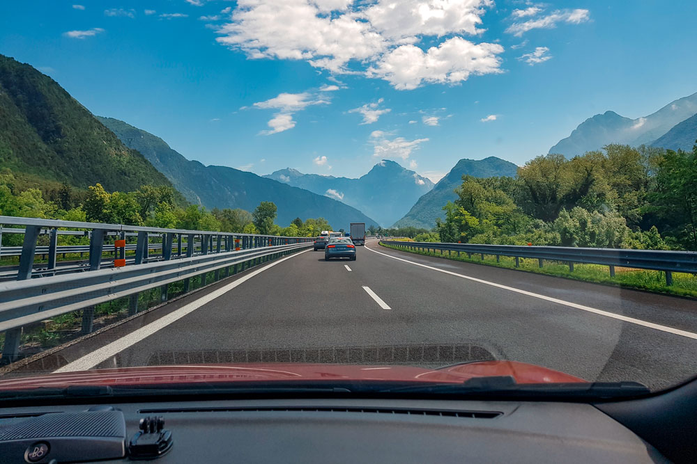 Driving on motorway in Europe, surrounded by beautiful landscape.