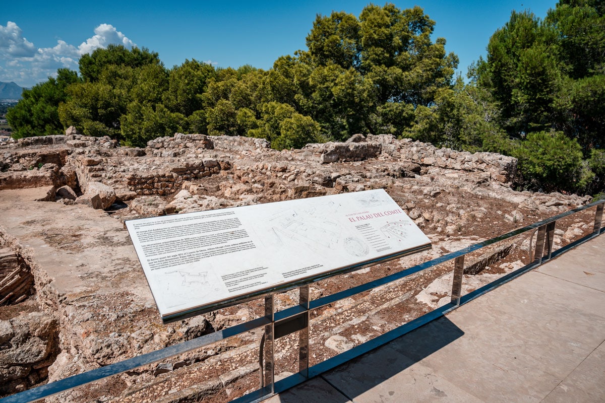 Denia castle ruins and information board.