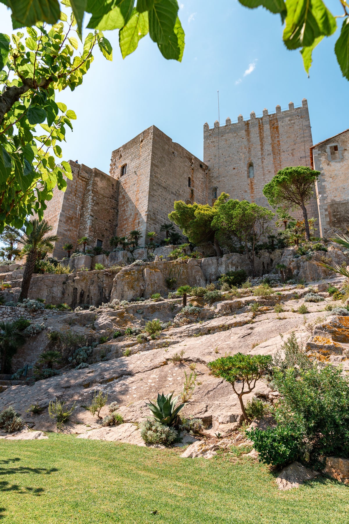 Green gardens and castle walls.