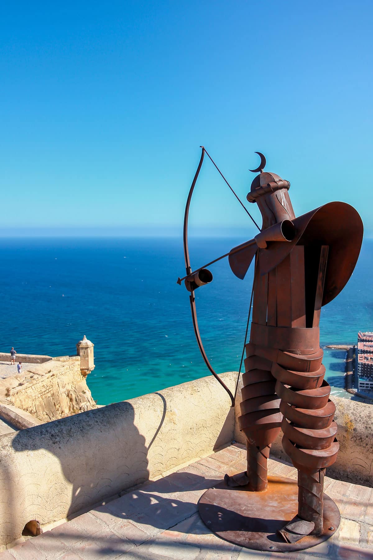 Metal statue of a medieval archer shooting a bow in Santa Barbara Castle of Alicante, Spain.