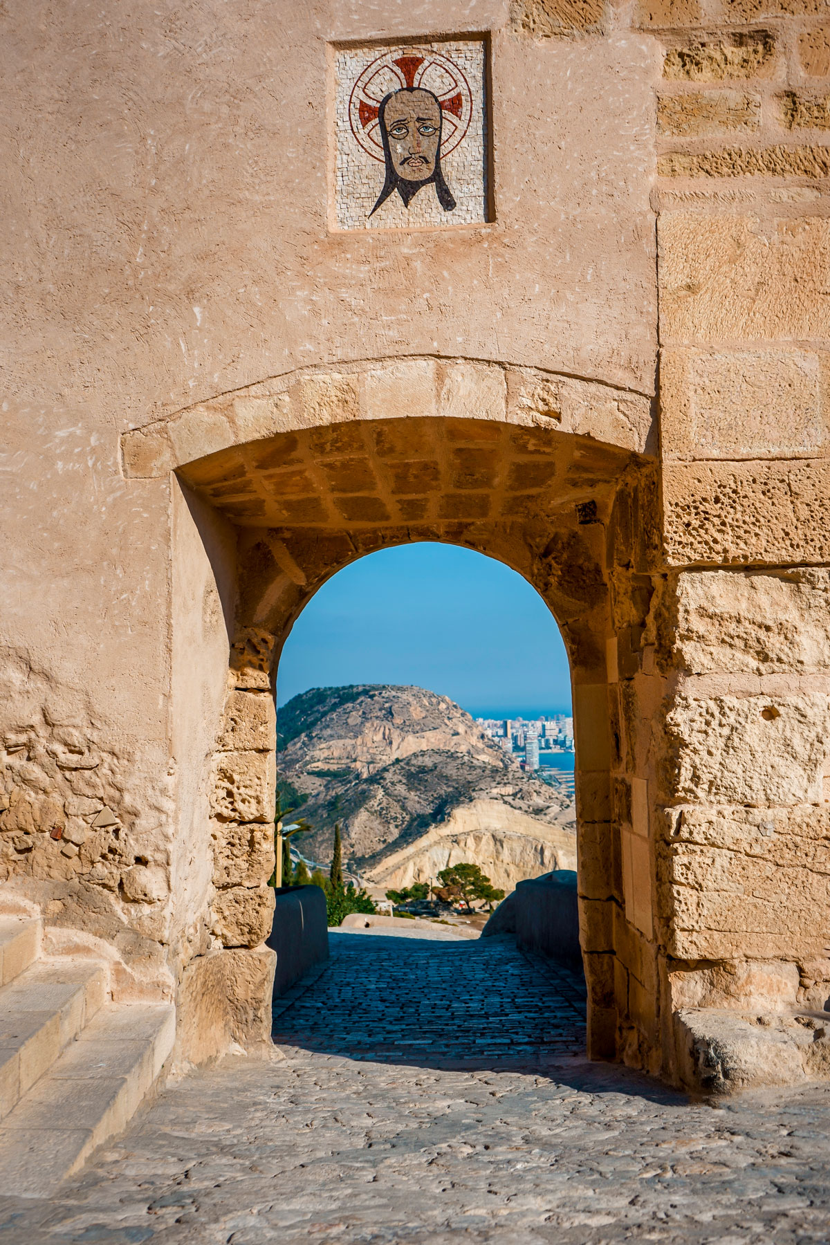 View through an arch of Alicante castle walls.
