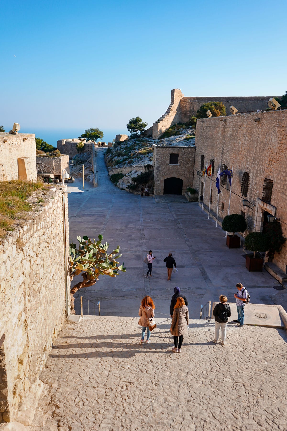 Visitors at the Alicante castle courtyard.
