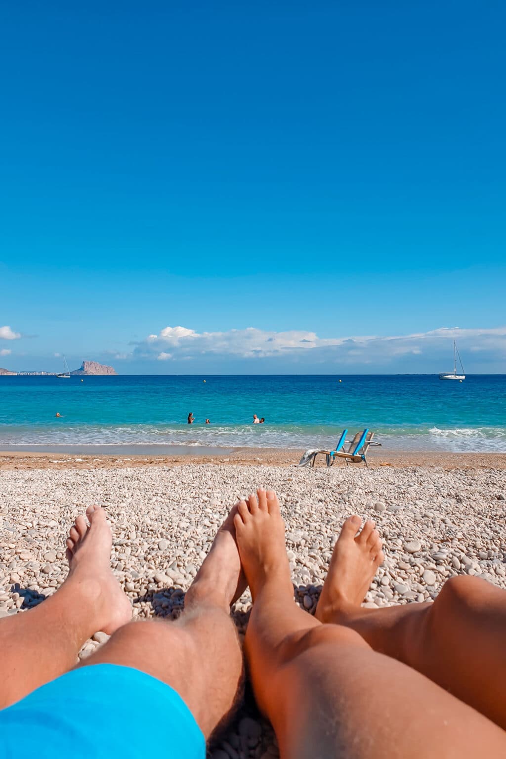 Couple relaxing on the beach.