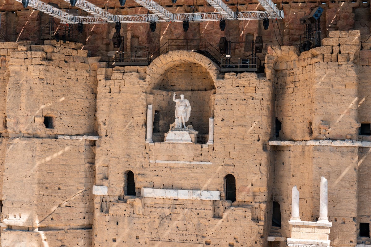 View of the Roman Theatre stage wall and seating in Orange, France.
