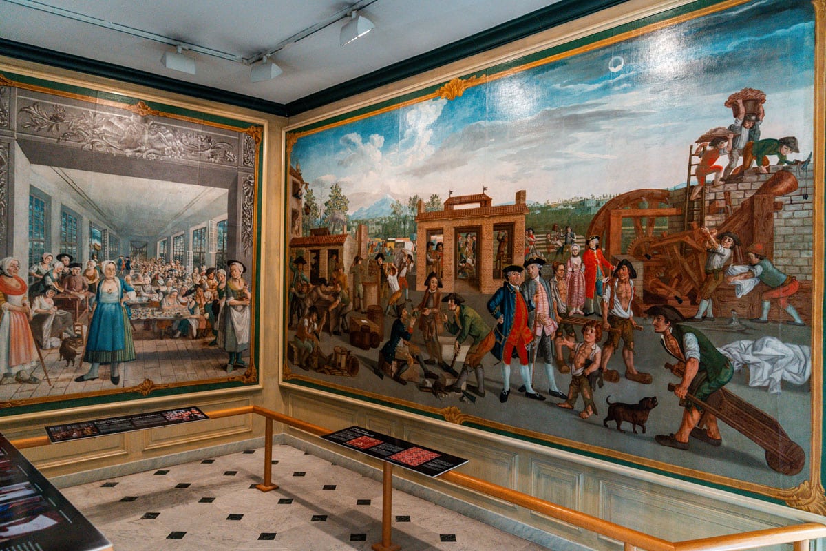A room in the museum with a large historical mural covering the walls.